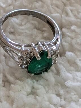 Silver Ring with Green Gemstone and Small Clear Stones